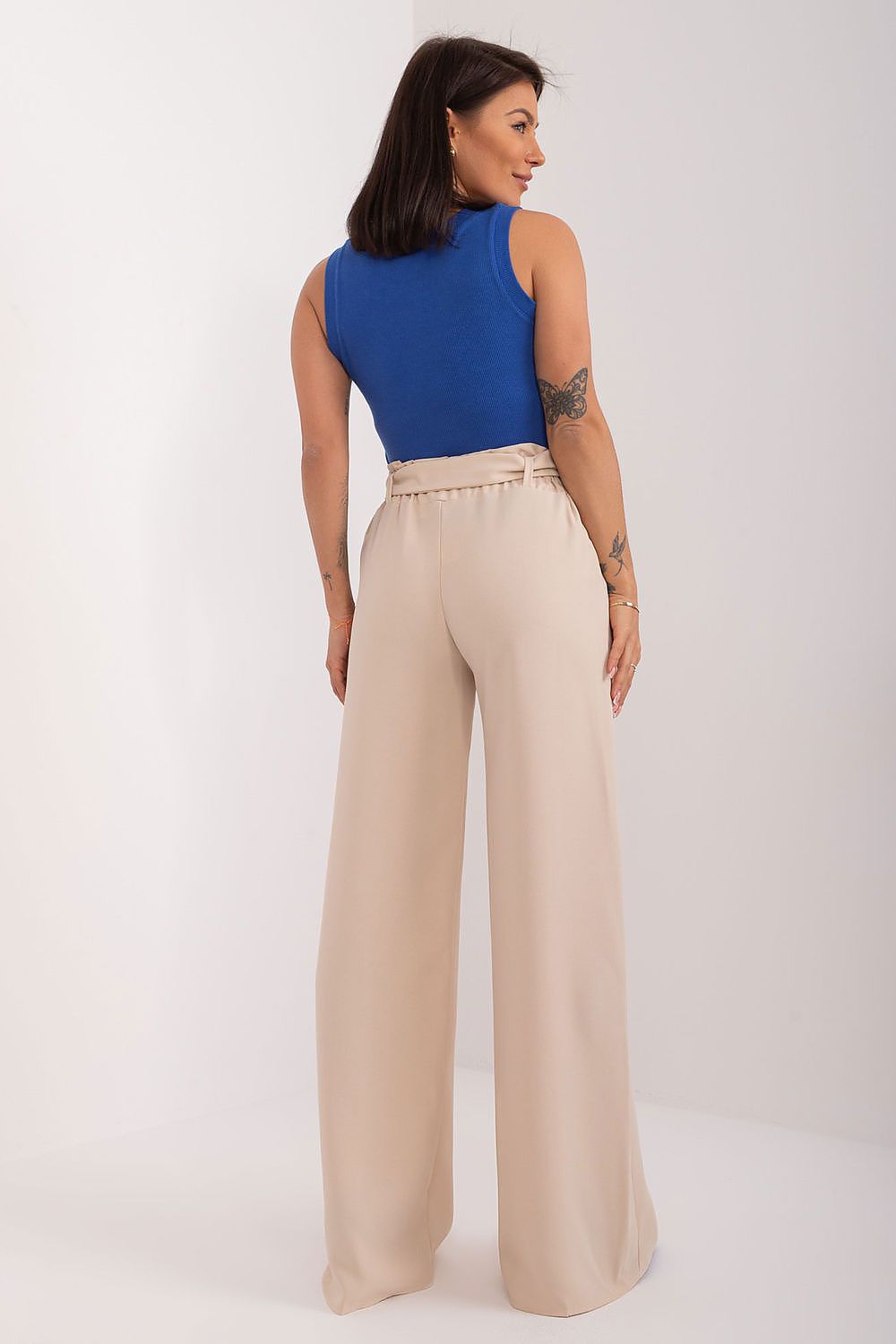Back view of elegant wide-leg trousers with buckled waistband by Rue Paris, highlighting the tailored fit and seamless design, ideal for chic office wear.