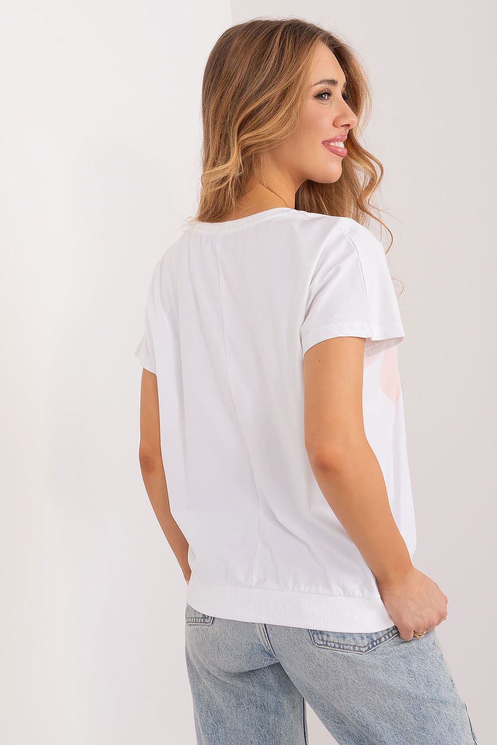 Back view of the chic Rue Paris casual cotton blouse, highlighting its smooth silhouette and relaxed fit, perfect for effortless summer style.