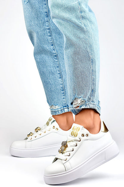 PRIMO Women's White Eco-Friendly Sport Shoes styled with jeans, showcasing a luxurious design and a comfortable 4.5 cm heel, perfect for fashionable athleticism.