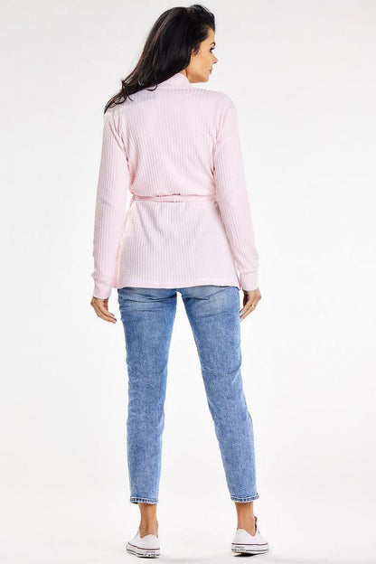 Back view of luxurious loose-fit pink cardigan featuring a shawl collar and belt, paired with denim, designed for comfort and style by awama.