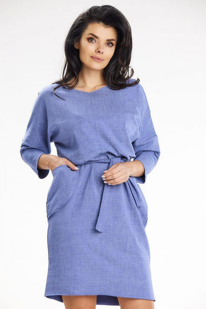 Elegant blue kimono sleeve daydress by awama featuring a heart neckline, a belt at the waist, and practical front pockets, ideal for casual outings.