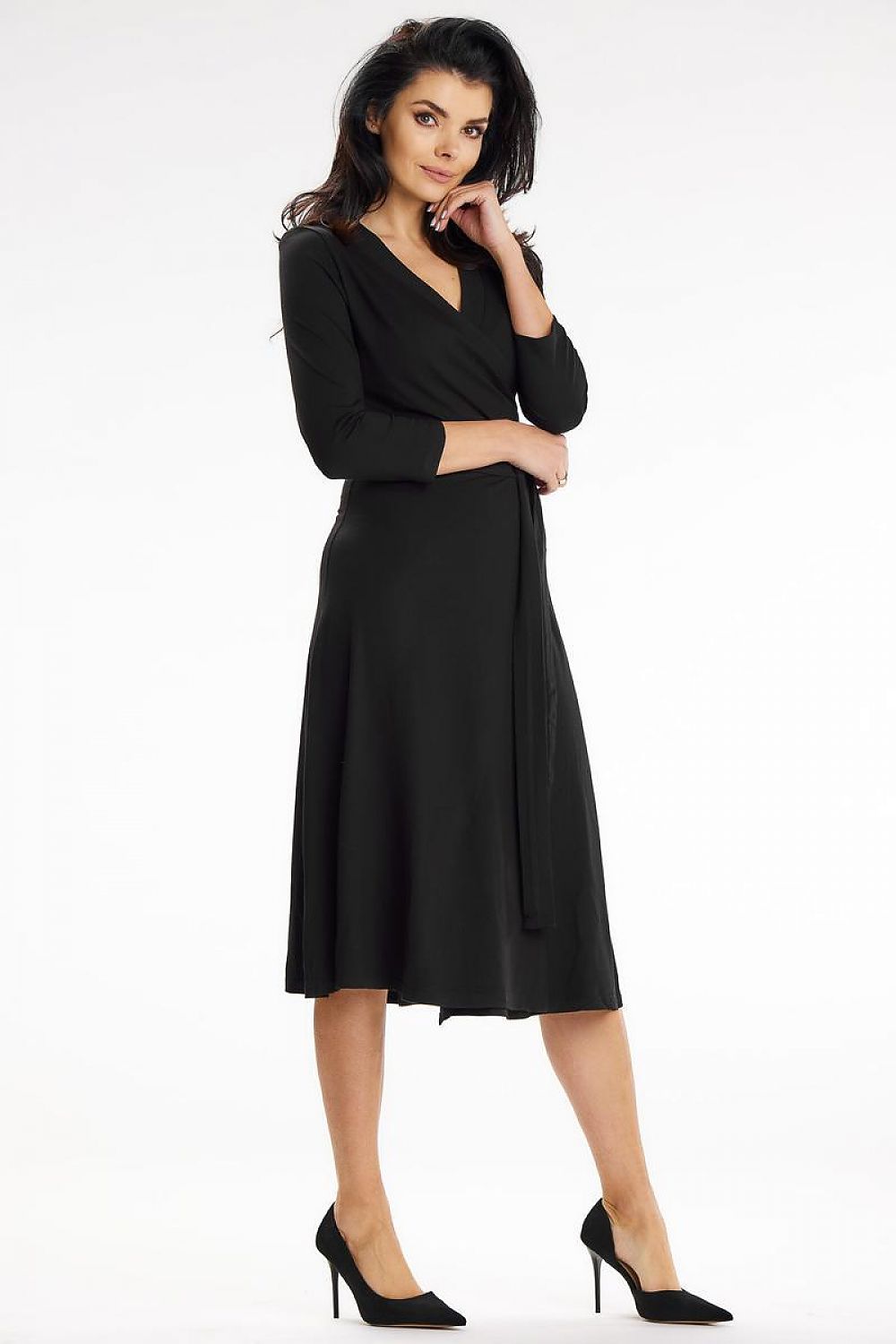 Sophisticated black midi dress by Awama featuring a fitted top, waist belt, and 3/4 sleeves, perfect for elegant occasions.