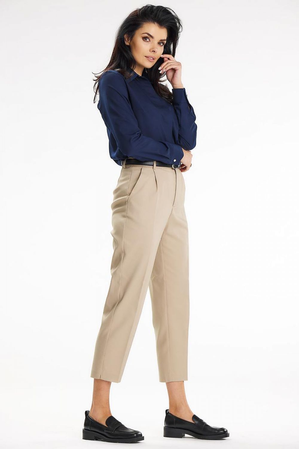 Side view of the elegant navy Awama long sleeve shirt, complemented by smart beige trousers, ideal for professional settings.