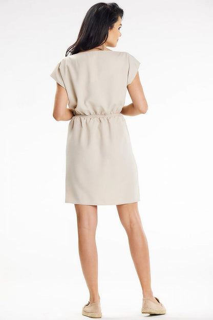 Beautifully draped mini dress by Awama in a summer-ready colour, exemplifying elegance and comfort with boat neckline.