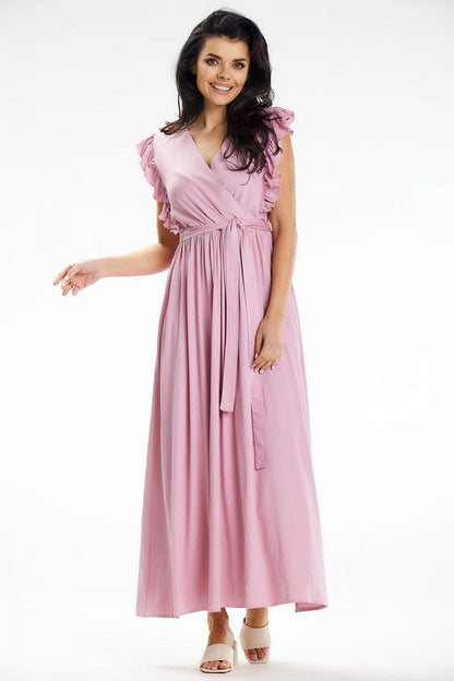 Awama summer maxi dress in a beautiful setting, highlighting the flowing design and chic belted waist.