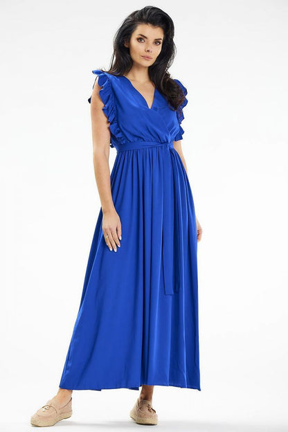 Model wearing the Awama summer maxi dress, epitomising luxury beach and city wear with an envelope neckline.