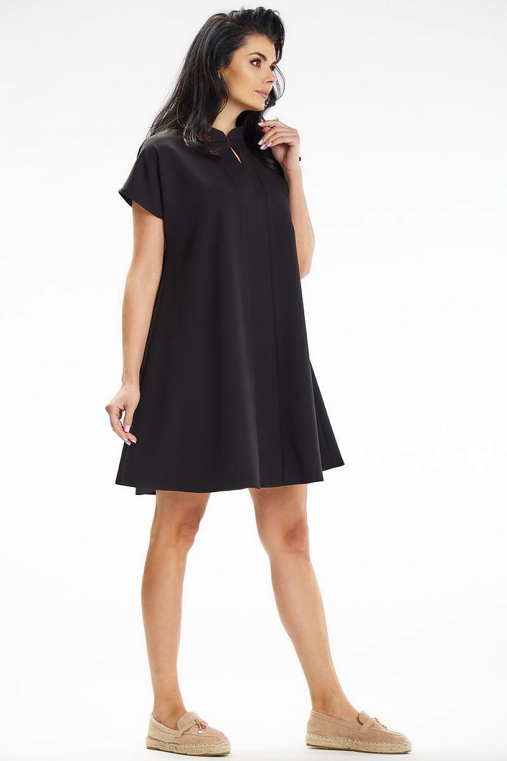 Chic Awama mini dress showcasing a modern slit neckline and stand-up collar, perfect for chic everyday styling.
