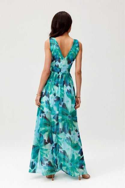 Elegant chiffon maxi dress with cutout back and flared skirt by Roco Fashion, designed for luxurious summer celebrations.