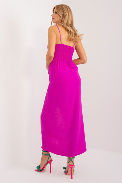 Elegant Italy Moda summer chic pencil dress featuring a decorative flower and sensual slit, showcasing sophistication and femininity.