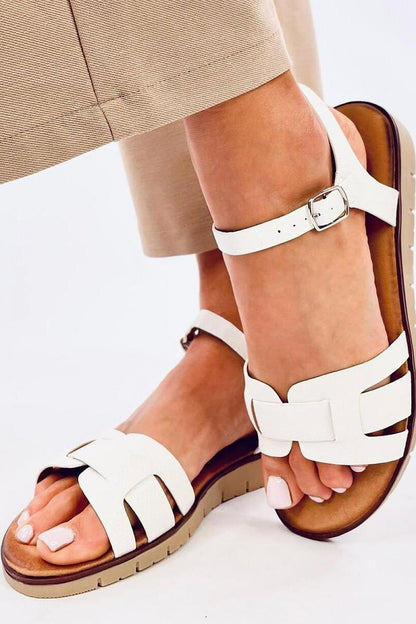 Stylish luxury Inello women's sandals with crossed straps showcasing eco-friendly leather, designed for ultimate comfort.