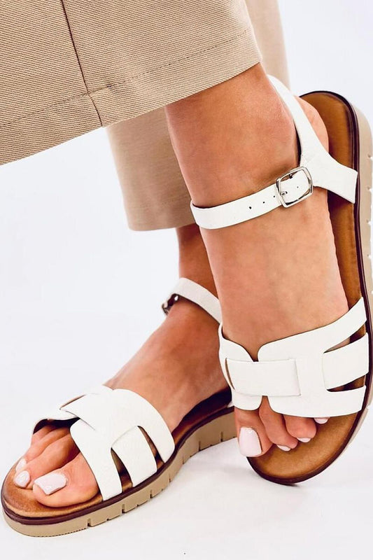 Stylish luxury Inello women's sandals with crossed straps showcasing eco-friendly leather, designed for ultimate comfort.