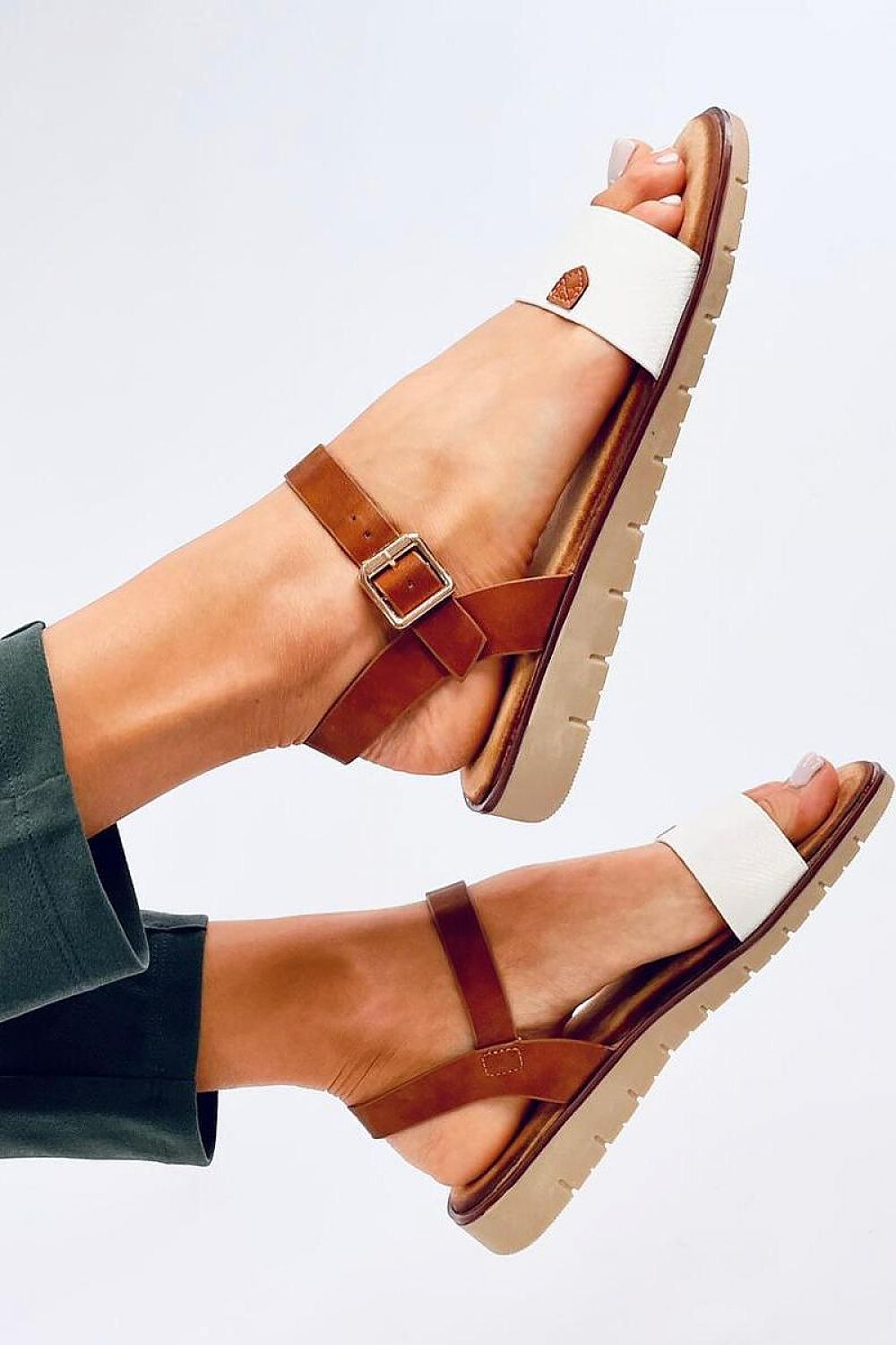 Close-up of Inello eco-leather sandals showcasing exquisite snake skin strap detail, perfect for stylish summer wear.