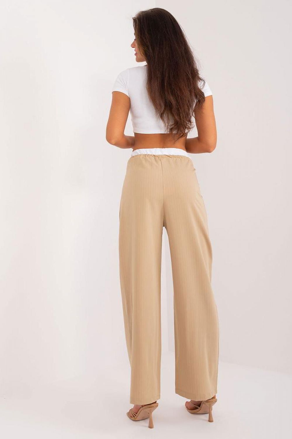 Italy Moda luxurious wide-leg palazzo trousers showcasing their high-quality polyester fabric, designed for ultimate comfort and sophistication.