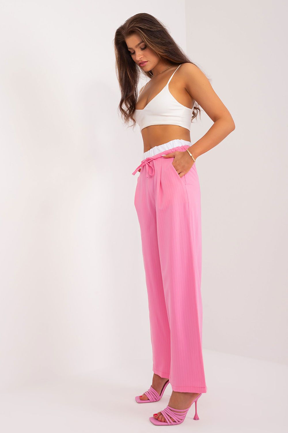Sophisticated high-waisted palazzo pants by Italy Moda, featuring decorative darts and slip-in side pockets for a blend of elegance and practicality.