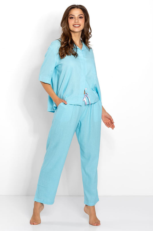 Elegant woman in a soft knit pajama set by Momenti Per Me, featuring a stylish collar and button closure, depicted in a serene turquoise shade, perfect for comfort and nursing.