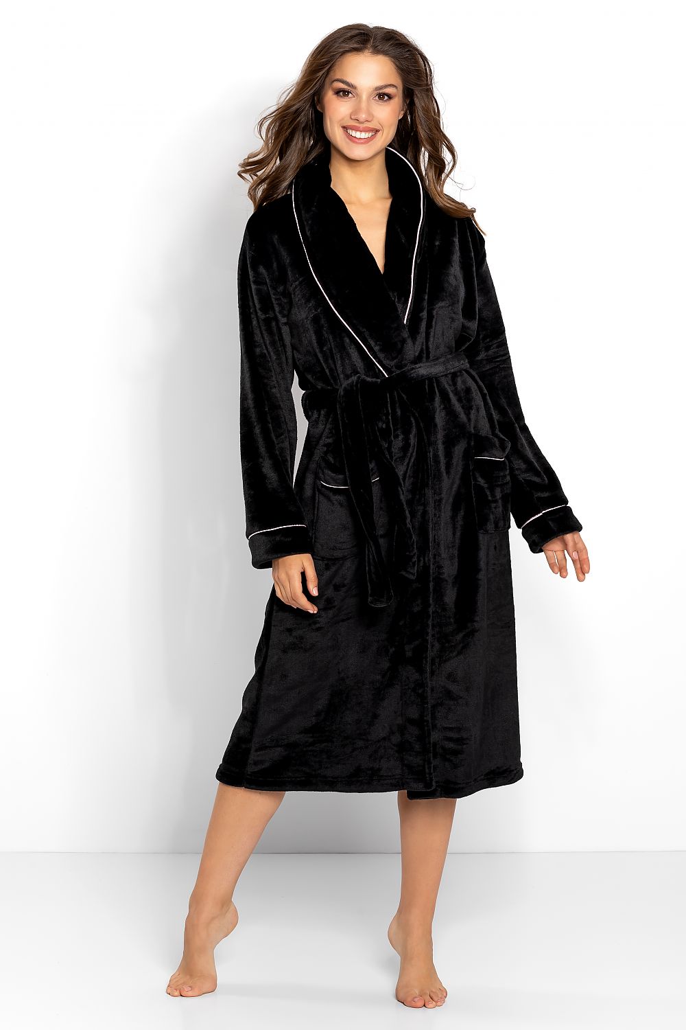 Elegant women's bathrobe in black velvet adorned with stylish piping, featuring long sleeves, pockets, and a tie belt, designed for ultimate luxury and comfort.