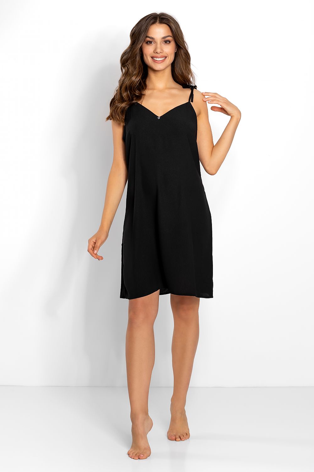 Chic black nightgown with elegant tied straps and a revealing side slit, perfect for a luxurious evening wear experience.