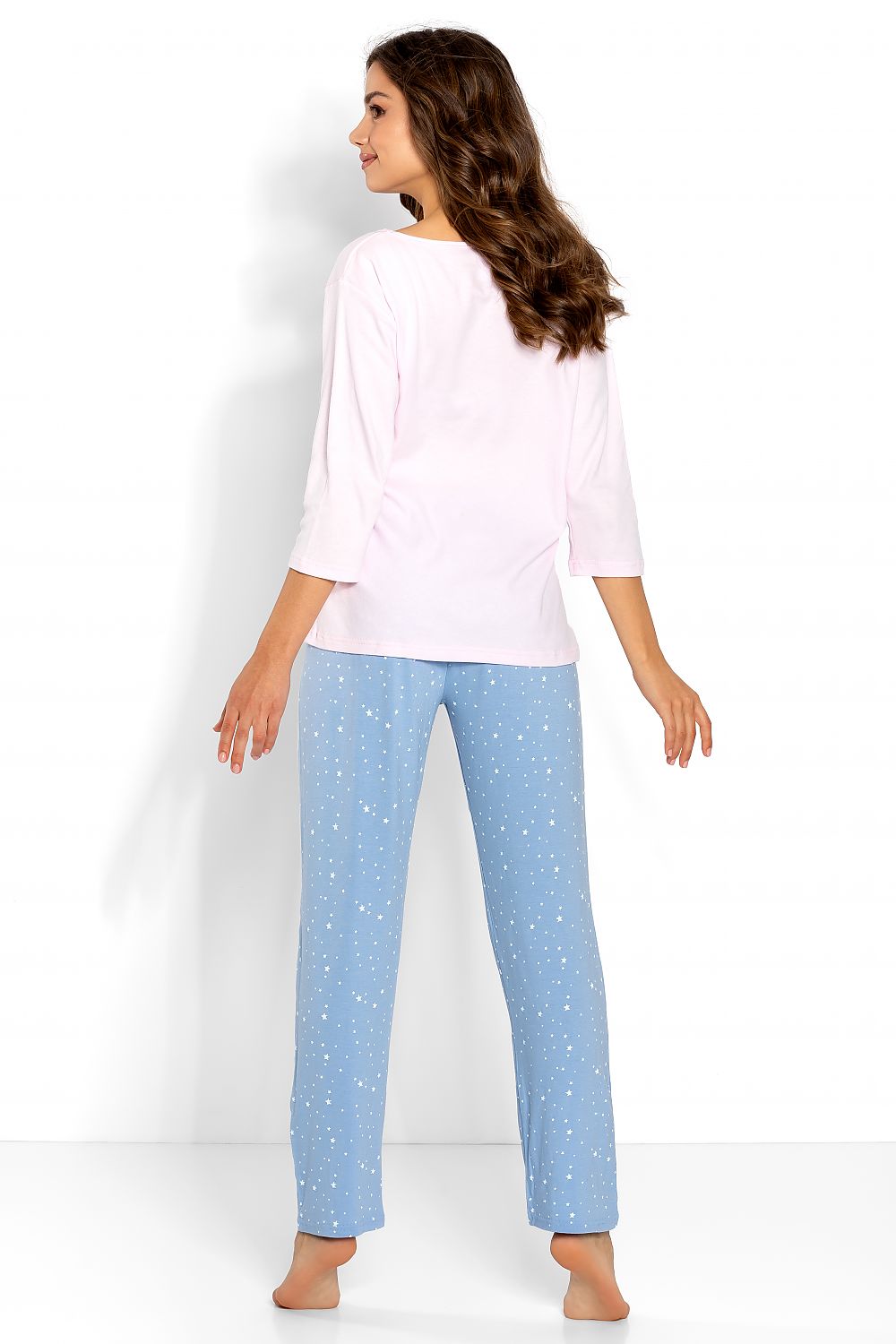 Back view of luxury women's pyjama set, showcasing a soft pink 3/4 sleeve blouse complemented by chic blue printed long pants, perfect for a night of relaxation.
