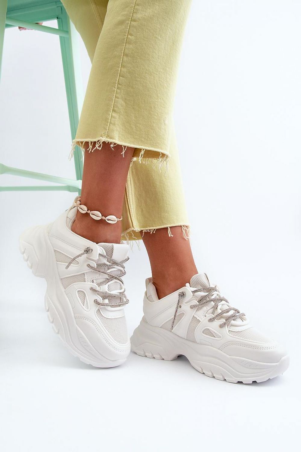 Stylish women's platform sneakers with decorative lacing by Step in Style, featuring a high-quality artificial leather design for ultimate comfort.