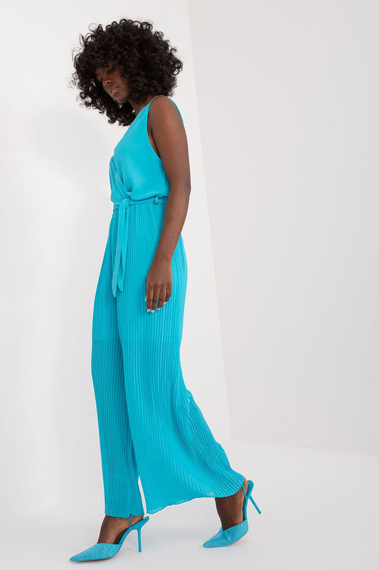 Chic pleated bottom sleeveless jumpsuit from Italy Moda, featuring an envelope neckline and waist tie for a sophisticated summer look.