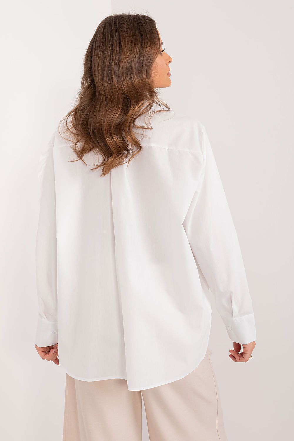 Close-up of the decorative flower embellishment on Lakerta's Women's Long Sleeve Cotton Shirt, emphasizing unique style and elegance.