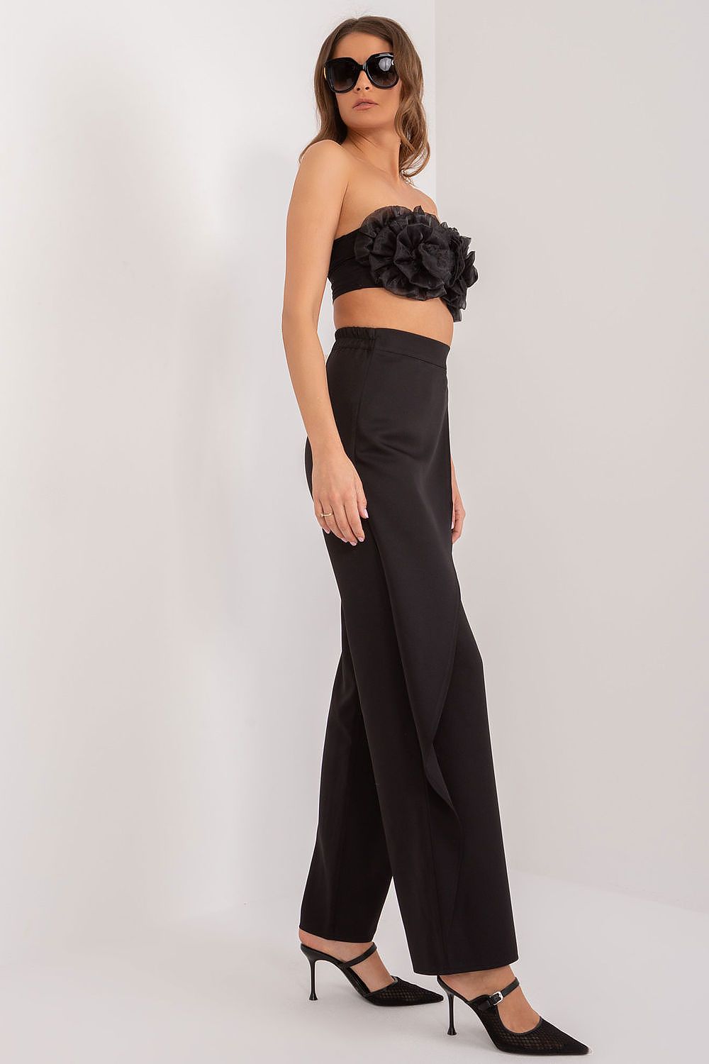 Versatile women’s trousers by Lakerta in a stylish setting, perfect for important meetings or upscale events.