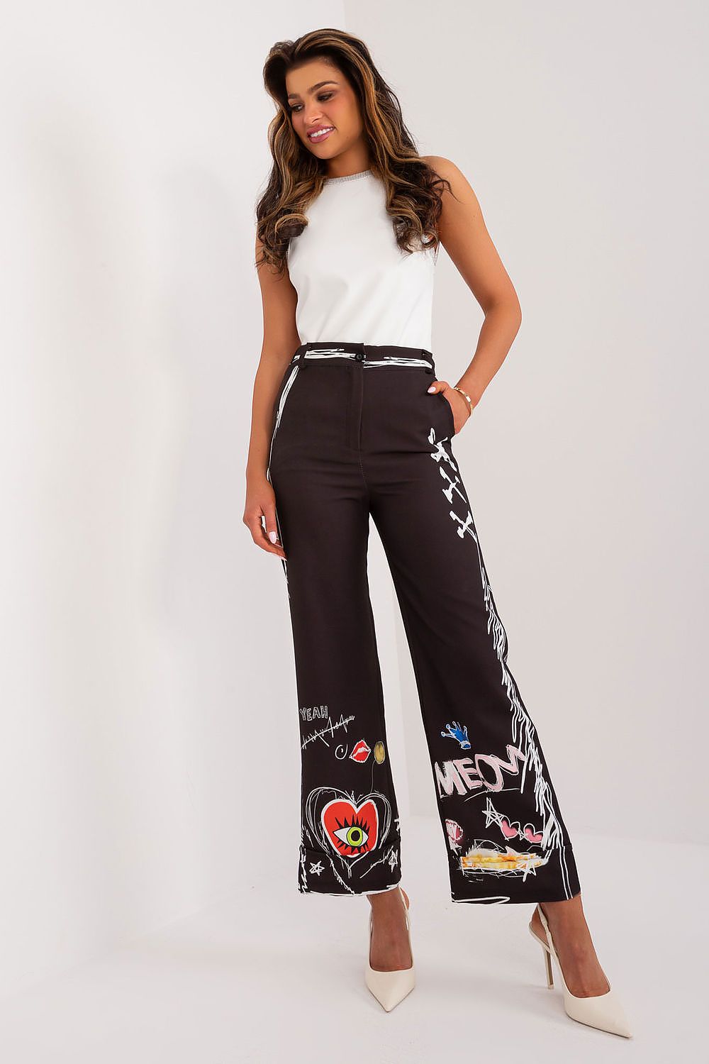Elegant high-waisted women's trousers by Italy Moda featuring a vibrant colourful print. Made from a luxurious blend of 95% polyester and 5% spandex for superior comfort. The wide-leg style offers both freedom of movement and chic sophistication, making them ideal for any casual occasion.