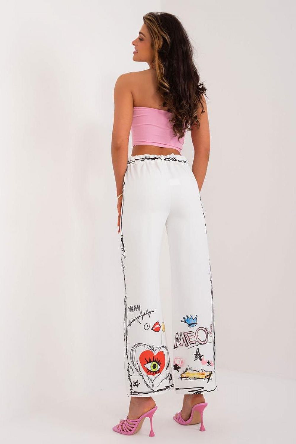 High-waisted women's trousers by Italy Moda featuring a vibrant, colourful print, crafted in a premium polyester and spandex blend for luxurious comfort.