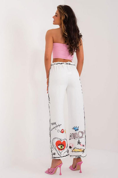 High-waisted women's trousers by Italy Moda featuring a vibrant, colourful print, crafted in a premium polyester and spandex blend for luxurious comfort.
