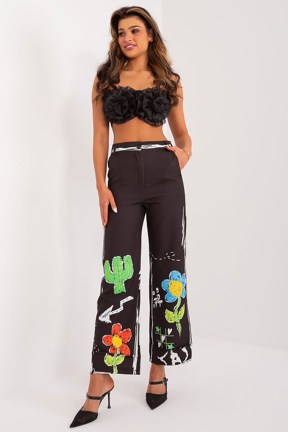 Glamorous wide leg trousers by Italy Moda, combining comfort and style with a stunning colourful print, perfect for the modern woman on-the-go.