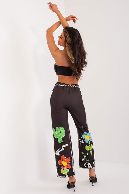 Luxurious polyester and spandex blend high-waisted trousers by Italy Moda, designed with a lively print and wide legs for ultimate comfort and style.