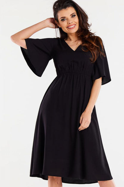 Elegant Flared Daydress by Awama in soft viscose, featuring a luxurious elastic waistband and wide sleeves for a perfect fit.