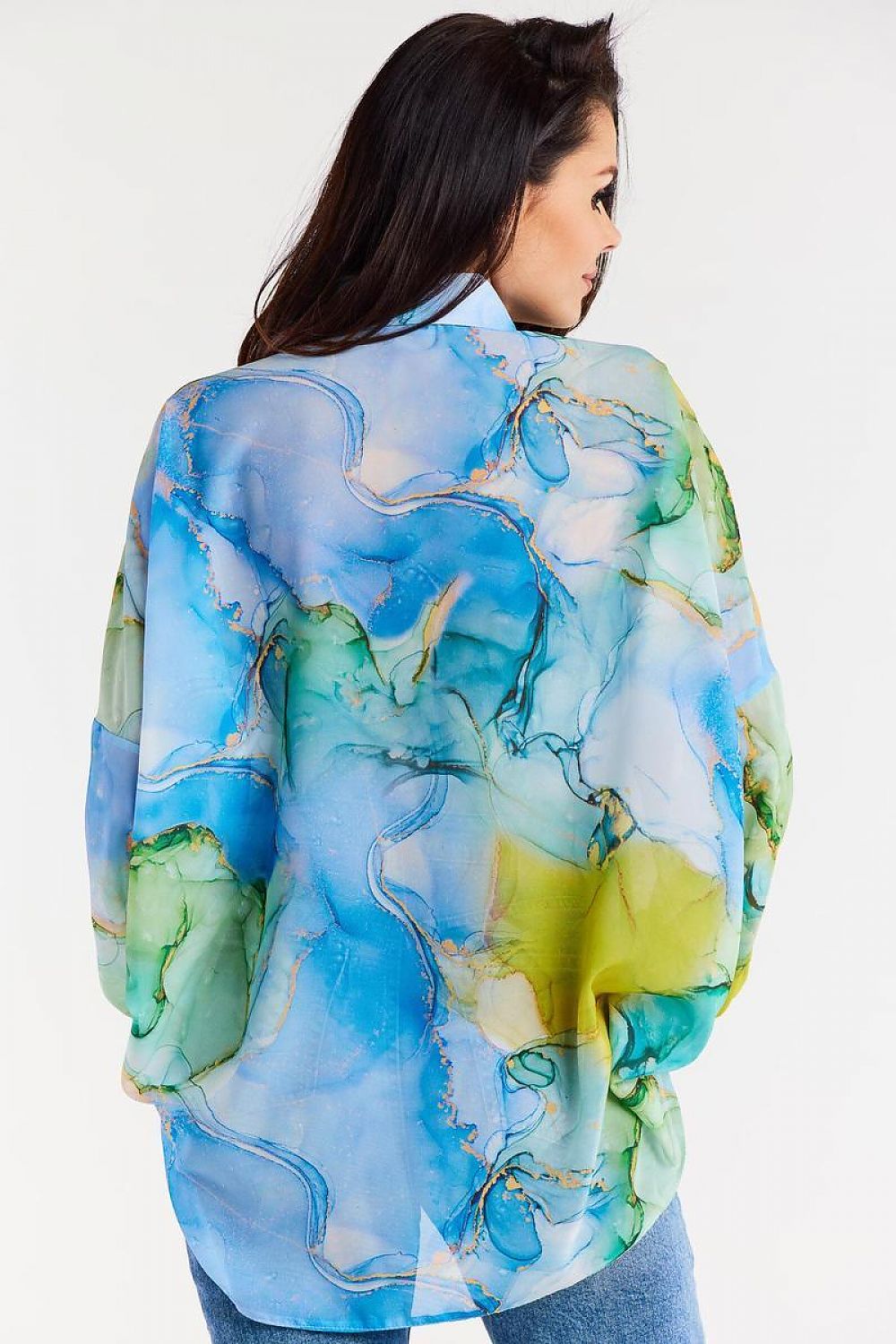 Flat lay of the oversized chiffon shirt with ruffled cuffs by Awama, styled with fashion accessories for a luxe aesthetic.