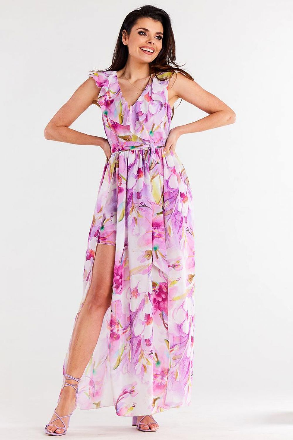 Model wearing the Awama chiffon daydress with waist belt, embodying luxury and style in a vibrant summer setting.