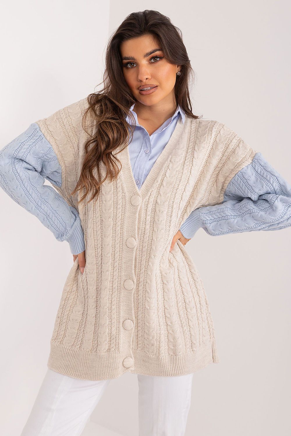 Elegant long sleeve cardigan by Badu, crafted from soft acrylic and wool blend, featuring a heart neckline for a touch of luxury. Perfect for versatile everyday wear.