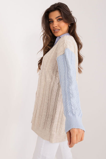 Close-up of Badu's stylish long sleeve cardigan, highlighting the heart neckline and contrasting sleeve design, offering elegant comfort for any occasion.