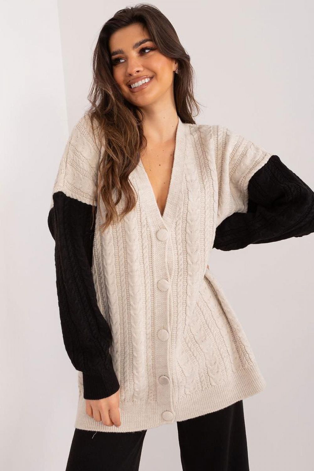 Chic Badu cardigan displayed in a flattering pose, highlighting its versatility and charm for everyday wear.