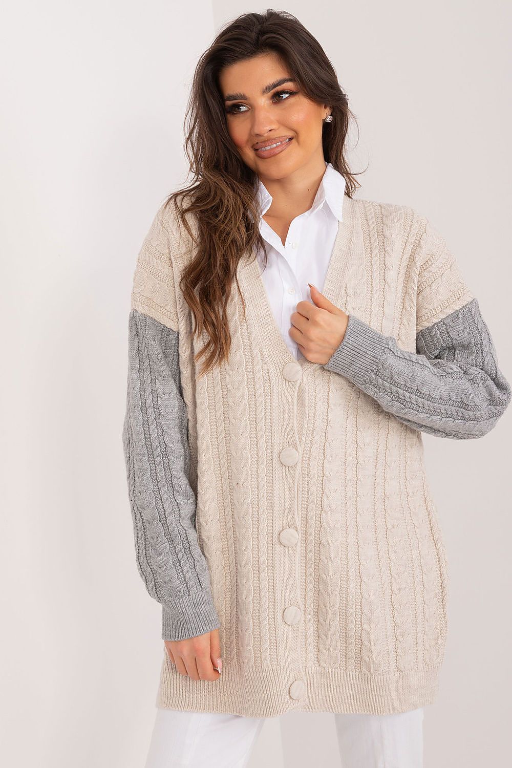 Badu's fashionable long sleeve cardigan displayed in a casual setting, demonstrating its versatility for both work and leisure.