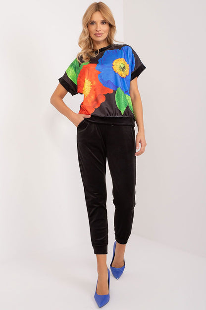 Stylish polyester velour set by Rue Paris, showcasing a unique print blouse and solid coloured drawstring pants.
