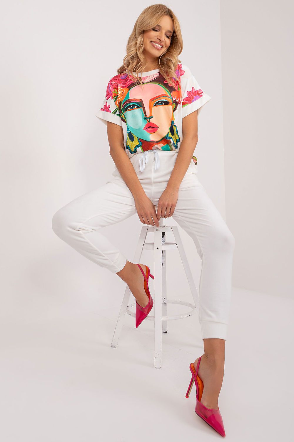 Close-up of the soft polyester blouse from the Rue Paris luxurious velour set, showcasing its unique print and short sleeves.