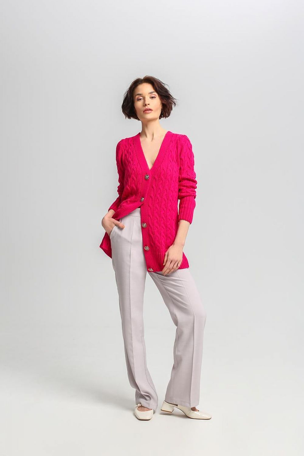 Stylish MKM cardigan featuring sophisticated crest buttons and a refined checkered pattern.