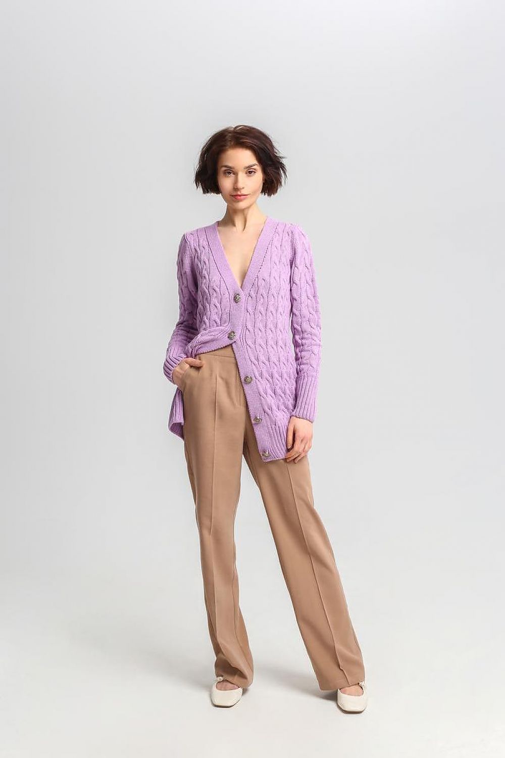 Luxurious MKM long cardigan with distinctive crest buttons, perfect for a chic appearance.