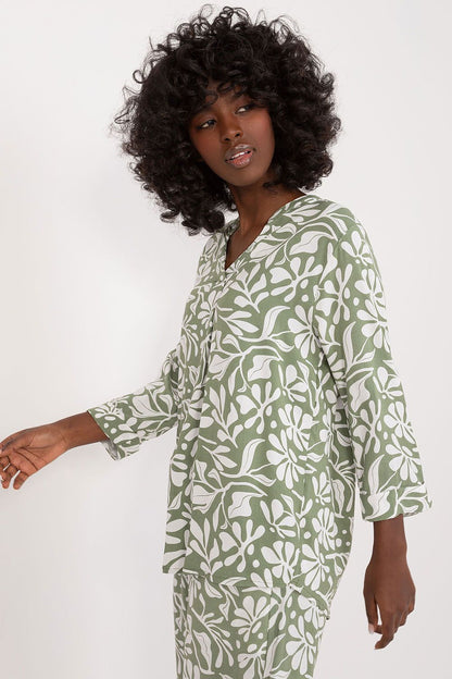 Elegant Sublevel Soft Viscose Blouse showcasing a decorative front pleat and 3/4 sleeves, perfect for pairing with jeans or skirts in a lively print.