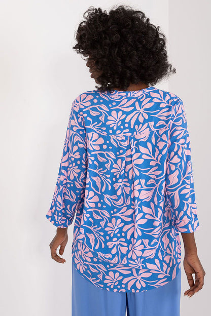 Back view of Sublevel's luxurious viscose blouse in colorful print, showcasing its classic 3/4 sleeves and perfect fit.
