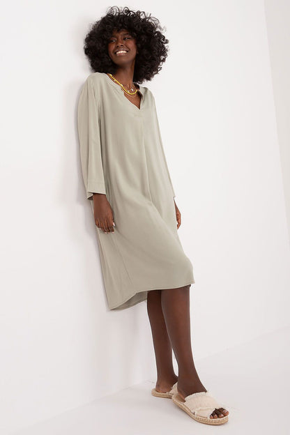 Elegant oversized V-neck daydress by Sublevel, showcasing a minimalist design in lightweight viscose, perfect for casual and formal occasions.