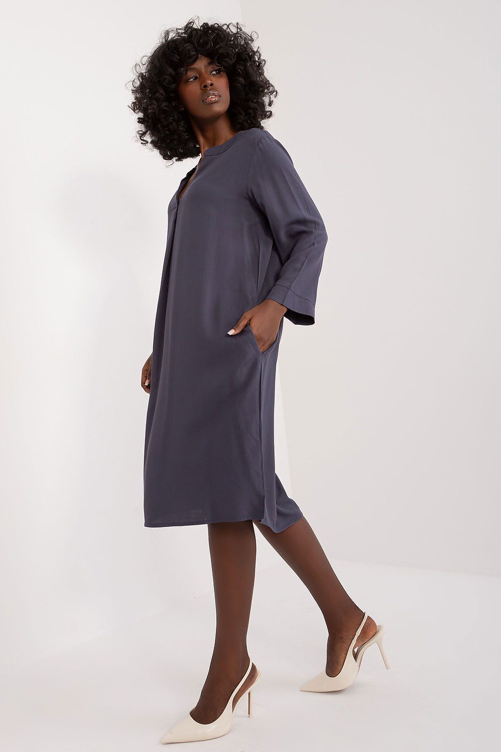 Detail of the Sublevel oversized V-neck daydress, featuring the fine viscose material and its elegant, understated design suitable for daily wear.