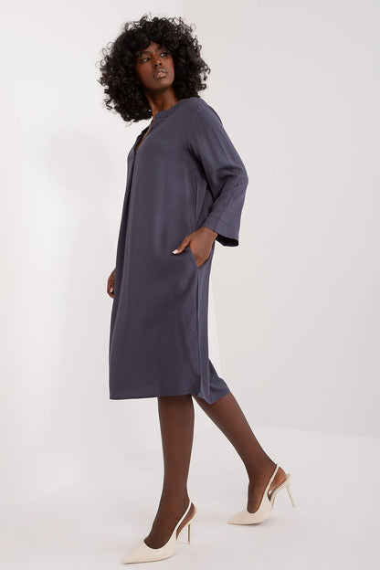Detail of the Sublevel oversized V-neck daydress, featuring the fine viscose material and its elegant, understated design suitable for daily wear.