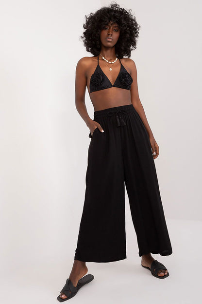 Elegant Women's Palazzo Pants by Sublevel in soft viscose, featuring a high rise and comfortable fit, designed with practical pockets and wide legs for a chic look.