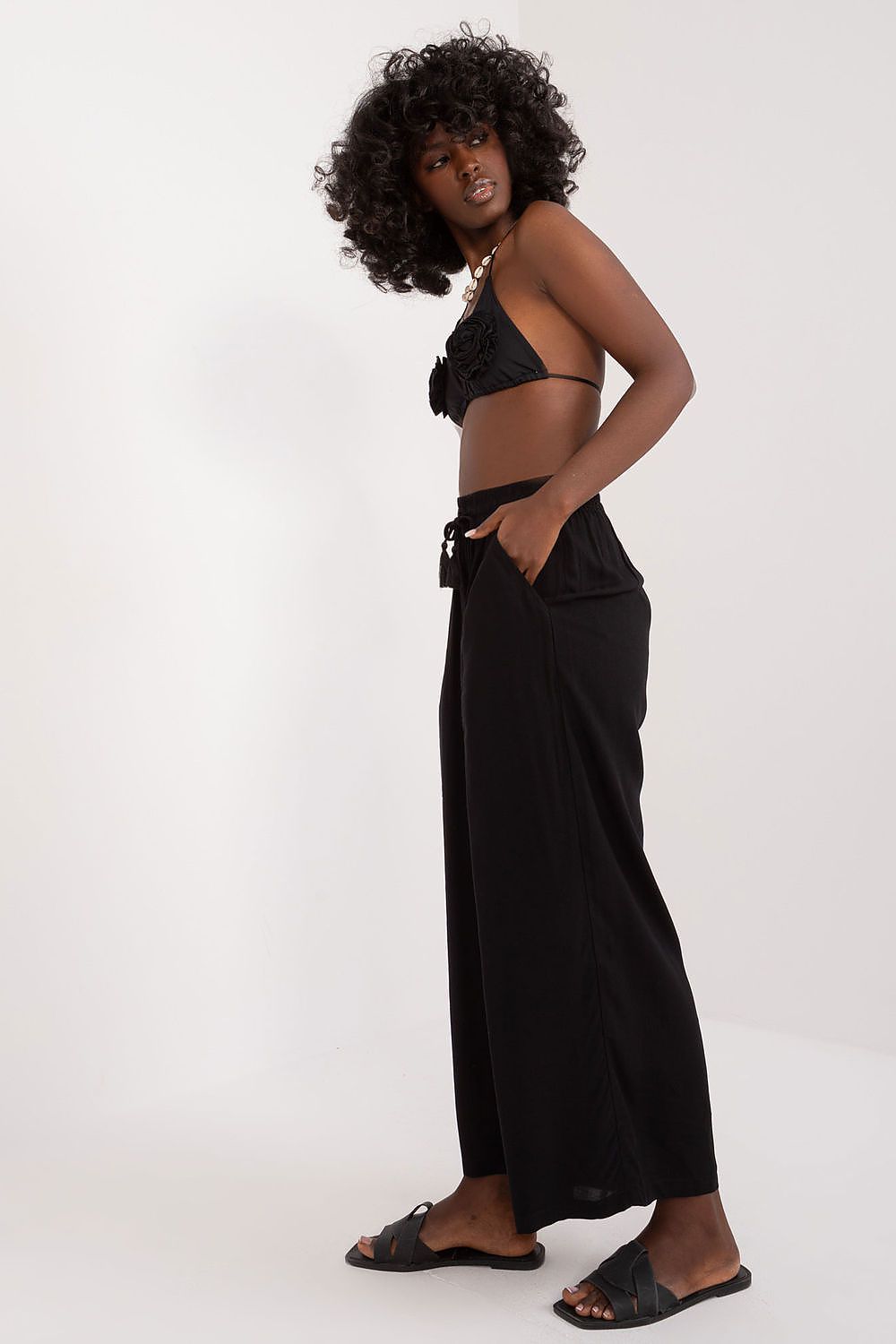 Luxurious high rise Palazzo Pants for women by Sublevel, crafted from breathable viscose, offering a flattering silhouette and ideal for versatile styling.