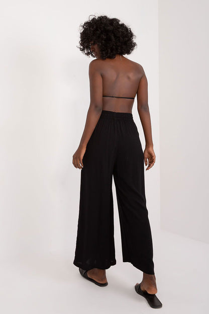 Elegant women's palazzo pants by Sublevel in soft viscose, showcasing high rise and wide leg design for a luxurious silhouette.